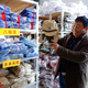 Ren Qingsheng, of Daiji’s Dinglou village, shows off a hat sold as part of a World War II-era Japanese army costume.